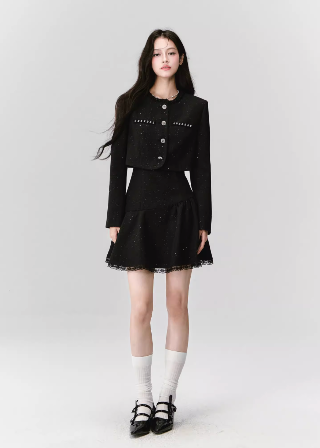 A constellation of refinement — the Noir Étoile Ensemble merges classic Parisian tailoring with Fragileheart’s pastel-noir sensuality. The cropped glitter tweed jacket and sculpted mini dress shimmer with quiet confidence, revealing both softness and strength. Perfect for evenings when sophistication meets modern rebellion.