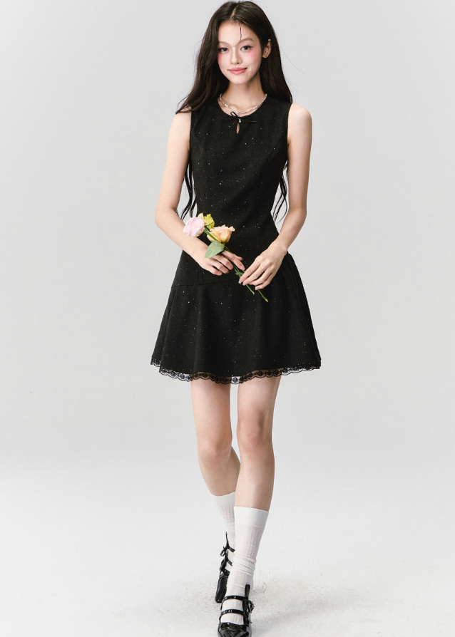 A constellation of refinement — the Noir Étoile Ensemble merges classic Parisian tailoring with Fragileheart’s pastel-noir sensuality. The cropped glitter tweed jacket and sculpted mini dress shimmer with quiet confidence, revealing both softness and strength. Perfect for evenings when sophistication meets modern rebellion.