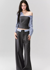 Where intellect meets allure — the Philosophical Trajectory Set redefines structured femininity through sculpted tailoring and poetic imbalance. The asymmetric neckline bares one shoulder in quiet defiance, merging plaid intellect with charcoal precision. Designed for the woman whose grace carries both thought and edge.