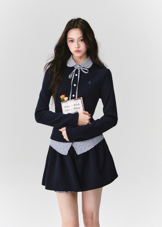 The Moon Academy Knit Set reimagines classic school-girl charm through Fragileheart’s lens of quiet luxury. Featuring a fitted knit blouse with a gingham collar and bow detail, paired with a matching pleated skirt, this ensemble balances intellectual poise and youthful softness. Perfect for autumn transitions and city walks that whisper elegance, not effort.