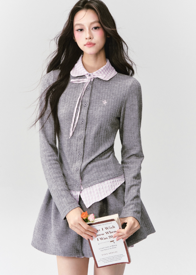 The Moon Academy Knit Set reimagines classic school-girl charm through Fragileheart’s lens of quiet luxury. Featuring a fitted knit blouse with a gingham collar and bow detail, paired with a matching pleated skirt, this ensemble balances intellectual poise and youthful softness. Perfect for autumn transitions and city walks that whisper elegance, not effort.