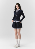 The Moon Academy Knit Set reimagines classic school-girl charm through Fragileheart’s lens of quiet luxury. Featuring a fitted knit blouse with a gingham collar and bow detail, paired with a matching pleated skirt, this ensemble balances intellectual poise and youthful softness. Perfect for autumn transitions and city walks that whisper elegance, not effort.