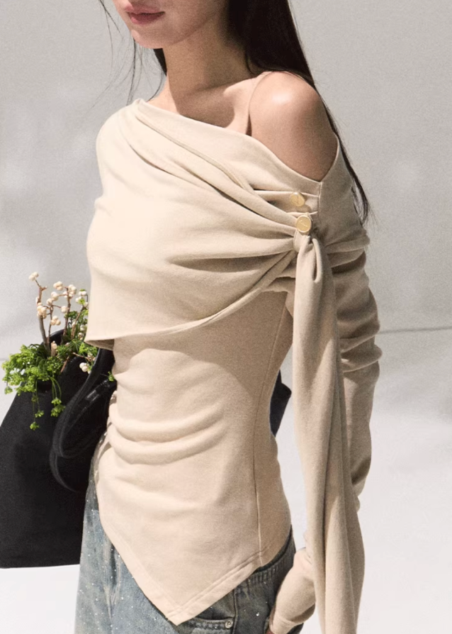 OAKMOO wrap knit top, asymmetric draped blouse women, off shoulder knit top, sculpted long sleeve shirt, chic street fashion top, minimalist Korean knitwear, modern wrap blouse, autumn winter fashion 2025, OAKMOO AW collection, stylish off shoulder top