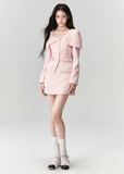 Fragileheart tweed set, pink bow jacket, luxury Korean fashion, elegant two-piece outfit, pastel tweed suit, quiet luxury womenswear, soft pink ensemble, French small fragrance style, K-fashion 2025, feminine office outfit, luxury tweed mini skirt set, romantic pastel look, modern elegant fashion, couture-inspired outfit