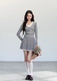 Fragileheart knit skirt set, lace V-neck sweater, pleated mini skirt outfit, luxury Korean fashion, quiet luxury womenswear, pastel noir aesthetic, elegant pre-autumn outfit, grey two-piece knit set, romantic feminine fashion, K-fashion 2025, vintage-inspired knitwear, soft Korean fashion, delicate pleated skirt look, refined knit coordination