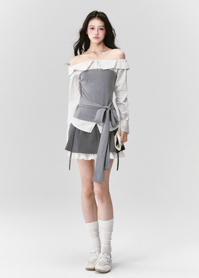 Fragileheart off-shoulder blouse, grey patchwork top, asymmetric layered shirt, luxury Korean fashion, elegant autumn outfit, quiet luxury style, pastel noir aesthetic, K-fashion 2025, structured feminine top, intellectual modern look, pre-fall womenswear, romantic Korean blouse, soft grey knit shirt, delicate tailored outfit