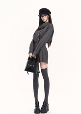 trench style mini dress women, pleated waist dress, british college dress women, edgy commuter dress, lapel mini dress women, dark minimalist fashion dress, vock dress style, tailored spring dress women, urban preppy dress, waist shaping mini dress, alternative office wear women, structured pleated dress, modern black gray dress, controlled silhouette fashion, early spring women dress