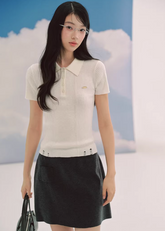 ivory polo knit top, slim fit knit tee, short sleeve knit women, korean fashion top, ribbed polo shirt women, minimalist knit top, feminine casual top, lightweight knitwear, everyday elegant outfit, soft knit blouse, parisian style top, fitted knit shirt, breathable summer knit, versatile basic top, refined casual wear, modern feminine clothing, chic simple top, aesthetic fashion knit, clean line top women, wardrobe essential knit