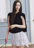 lyocell knit top, cape style top women, sleeveless knit top, korean fashion top, minimalist summer top, draped knit top, lightweight knitwear, breathable fabric top, modern feminine clothing, casual elegant top, soft knit blouse, parisian style clothing, versatile summer outfit, aesthetic fashion top, refined casual wear, clean line top women, flowy knit top, chic everyday top, simple design top, comfortable summer knit