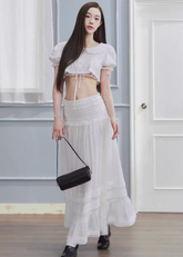 white maxi skirt, pleated long skirt, korean fashion skirt, flowy maxi skirt, elastic waist skirt, feminine long skirt, spring summer skirt, lightweight skirt women, elegant casual outfit, parisian style clothing, soft aesthetic skirt, tiered maxi skirt, breathable fabric skirt, modern feminine clothing, versatile long skirt, chic everyday outfit, refined casual wear, airy fabric skirt, graceful silhouette skirt, minimal elegant skirt