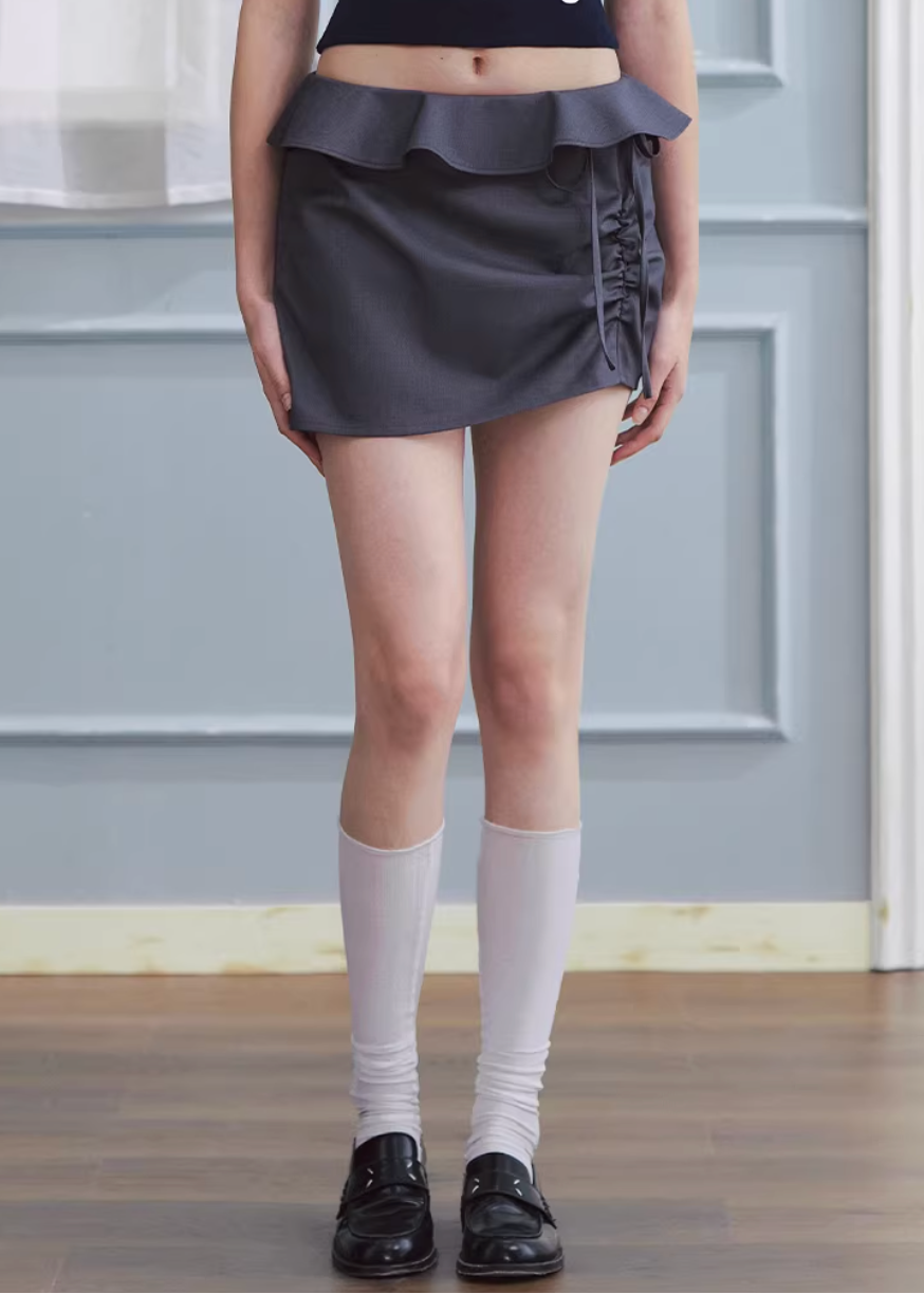 ruffled mini skirt women, low rise skirt, shirred mini skirt, korean fashion skirt, hip hugging skirt, spring outfit ideas, feminine mini skirt, casual chic skirt, aesthetic fashion skirt, modern feminine clothing, versatile mini skirt, lightweight skirt women, stylish short skirt, parisian style clothing, refined casual wear, body contour skirt, clean silhouette skirt, trendy mini skirt, everyday outfit skirt, spring mini skirt