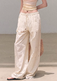 wide leg cotton pants women, embroidered pants women, korean fashion pants, spring outfit ideas, casual spring outfits, resort outfit women, loose fit trousers women, breathable cotton pants, soft aesthetic outfit, modern feminine clothing, parisian style clothing, versatile casual pants, chic everyday outfit, calm luxury fashion, lightweight summer pants, effortless style trousers, natural fabric pants, spring wardrobe bottoms, relaxed fit wide pants, bohemian style pants