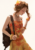 halter dress women, floral midi dress, summer resort dress, beach outfit women, summer outfit ideas, vacation dress women, aesthetic summer dress, boho summer dress, lightweight midi dress, chic summer outfit, flowy dress women, vibrant floral dress, travel outfit women, stylish summer dress, casual beach dress, trendy summer outfit, feminine summer dress, warm tone dress, statement summer dress, holiday outfit women