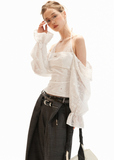 Floral embroidered cotton top styled with wide-leg pants