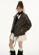 Distressed denim jacket and short skirt