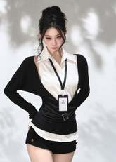 Black V-neck knit top layered over a white sleeveless collared shirt