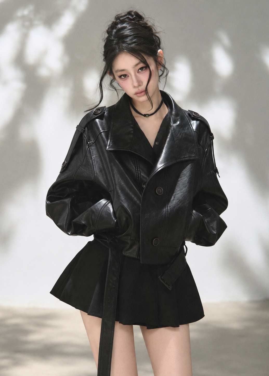 Black double-breasted cropped faux leather jacket with stand collar