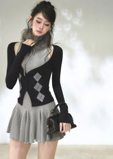 Grey flared mini dress with navy argyle knit cardigan and cutout shoulders