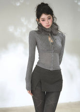 Women's fitted long sleeve argyle cardigan with button-front design