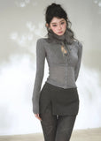 Women's fitted long sleeve argyle cardigan with button-front design