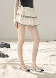 Ivory chiffon ruffle mini skirt with side bow