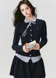 The Moon Academy Knit Set reimagines classic school-girl charm through Fragileheart’s lens of quiet luxury. Featuring a fitted knit blouse with a gingham collar and bow detail, paired with a matching pleated skirt, this ensemble balances intellectual poise and youthful softness. Perfect for autumn transitions and city walks that whisper elegance, not effort.