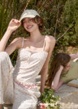 Feminine cream cami top with playful pastel pattern