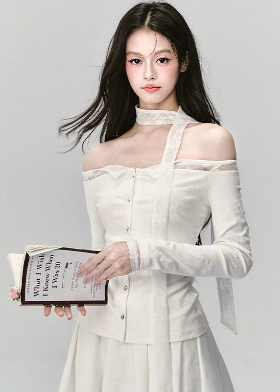 Ethereal and composed, the White Moonlight Sonata Set embodies Fragileheart’s quiet-luxury vision. The off-shoulder lace top and embroidered skirt whisper of moonlit evenings and polished confidence. Soft satin sheen meets delicate tailoring, creating a timeless silhouette that speaks of grace without needing attention.