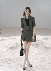 Gray tailored blazer skirt set with softly structured shoulders