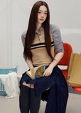 1. Sleeveless striped knit polo top styled with dark bottoms outdoors