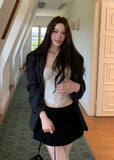 Charcoal gray oversized blazer with notched lapels and a two-button front