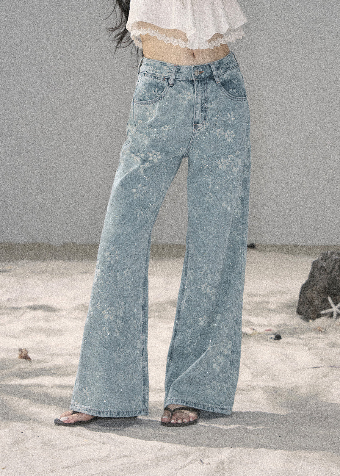Light blue floral wide-leg jeans with sparkling embellishments