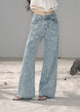 Light blue floral wide-leg jeans with sparkling embellishments
