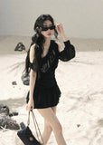 Black off-shoulder mesh top with ruched fit and sheer long sleeve