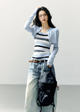 Pale blue cropped bolero with a navy and white striped camisole