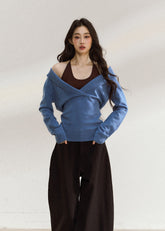 Blue asymmetric knit top with a wide foldover neckline
