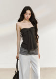 White draped cardigan with a charcoal gathered camisole