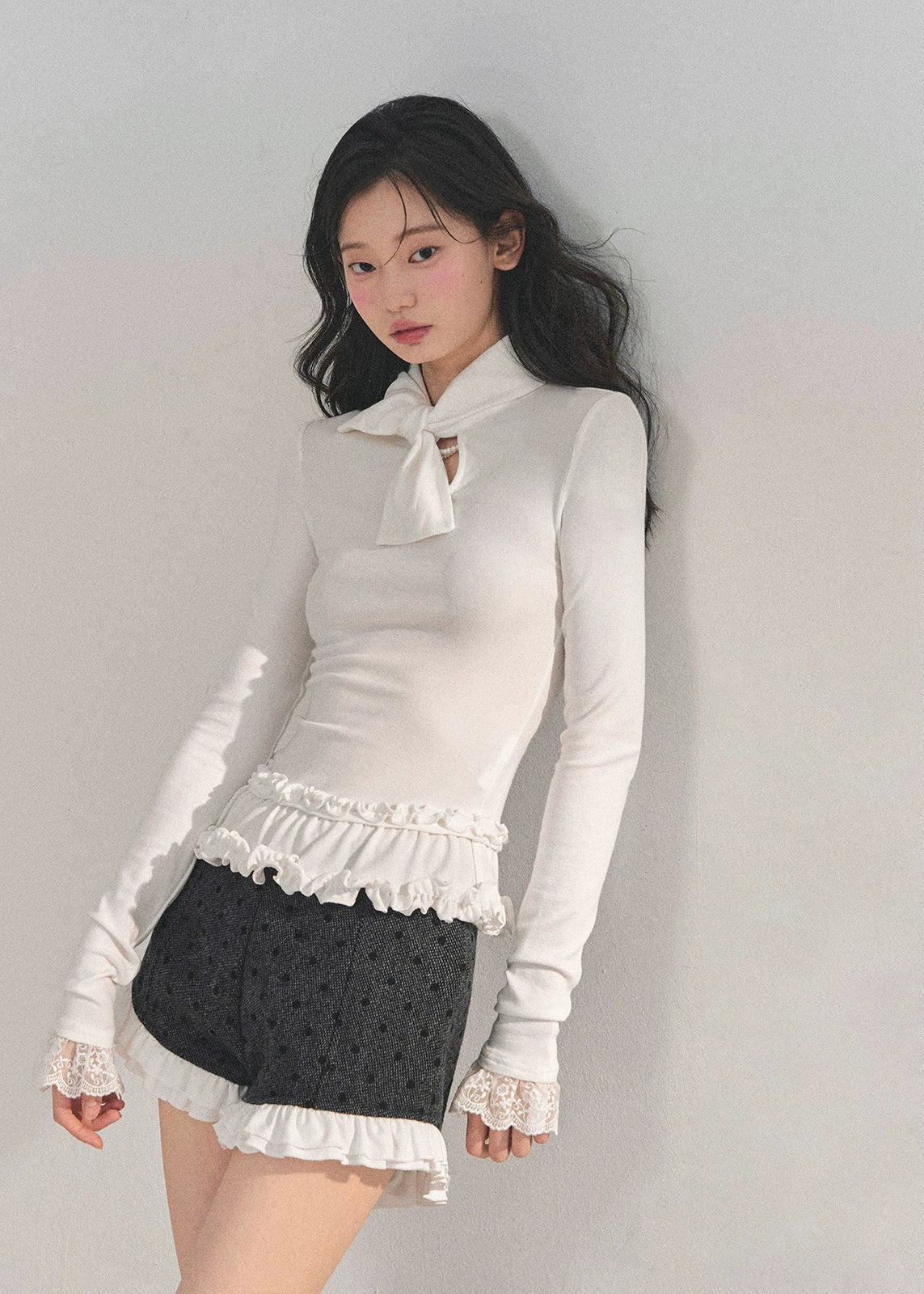 AOMALM top, Korean style knit top, fungus ruffle hem, bow lace T-shirt, winter feminine top, lace cuff long sleeve, soft knit blouse, aesthetic Korean fashion, winter layering top, slim fit tee women, elegant knitwear, ruffle lace shirt, cute winter tops, Korean girl outfit, soft girl aesthetic top, feminine long sleeve tee, winter fashion 2025, trending Korean tops, lace trim sweater top, chic bow neck shirt, romantic knit top.