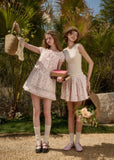 Soft pink doll dress with ruffle neckline