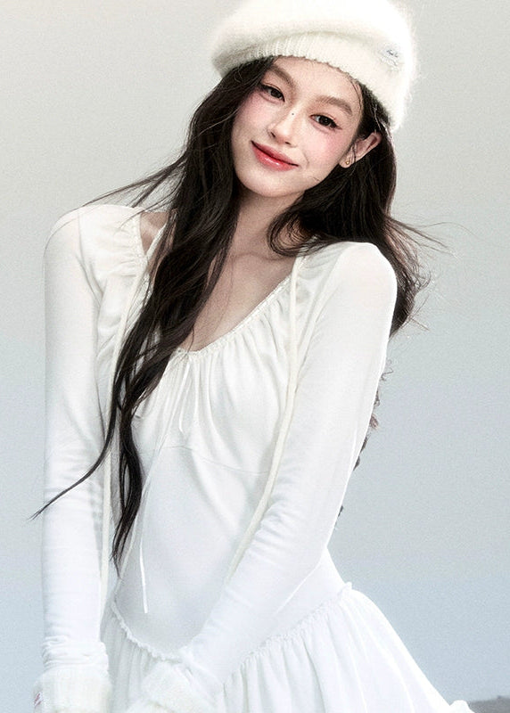 Fragileheart knit dress, ballet style outfit, ivory ruffle one-piece, luxury Korean fashion, quiet luxury womenswear, pastel noir aesthetic, elegant autumn dress, V-neck knit outfit, pre-autumn K-fashion, romantic feminine style, tiered ruffle skirt, soft Korean fashion, delicate white dress, graceful knit one-piece