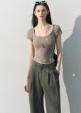 Textured short-sleeve top styled with wide-leg denim