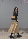 Khaki A-line midi skirt with a coordinating buckle belt
