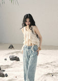 Ivory layered ruffle sleeveless top with cascading chiffon details