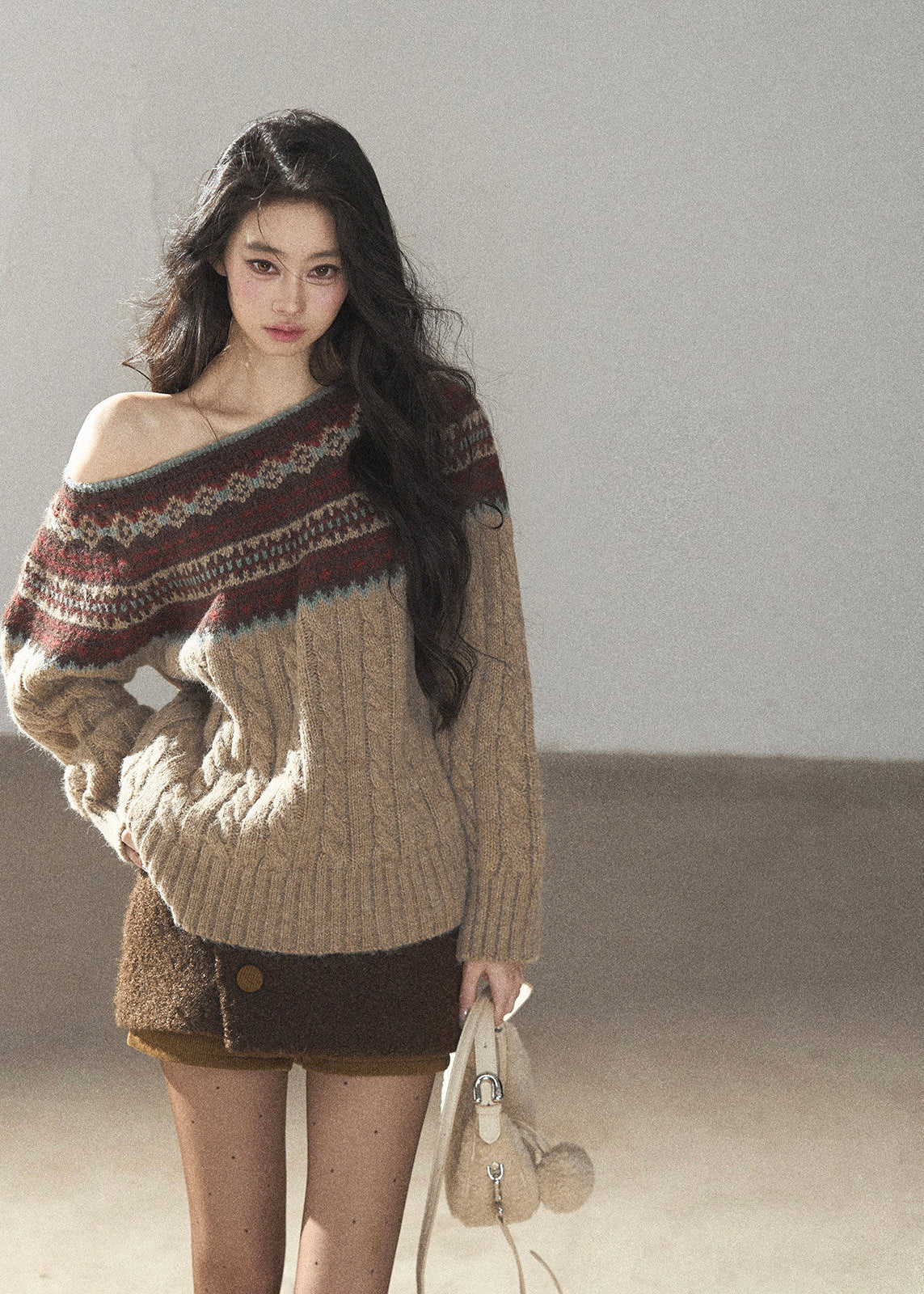 Beige Fair Isle off-shoulder cable knit sweater with multicolor jacquard pattern