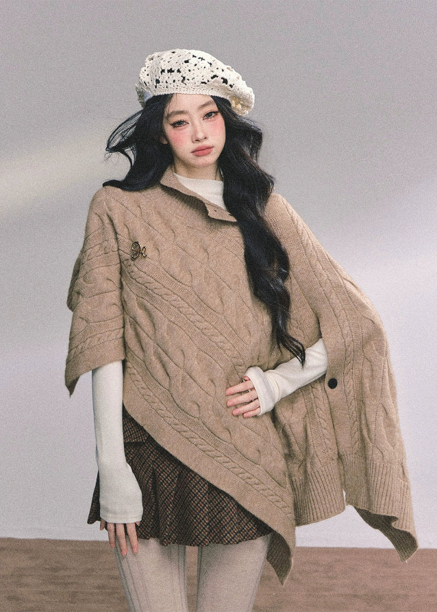 british muse cloak, knit sweater cloak, cable knit cape, french knit shawl, winter knitted cape women, twist knit cloak top, elegant knit outerwear, korean style knit cape, autumn winter knitwear, oversized knit shawl, chic cloak sweater, warm cable knit top, french luxury knitwear, nom alm style knit, womens winter fashion 2025