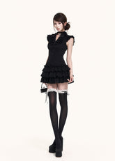 Black ruffle mini dress with flutter sleeves