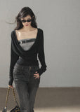 Black waist-fit draped top with gray inner layer