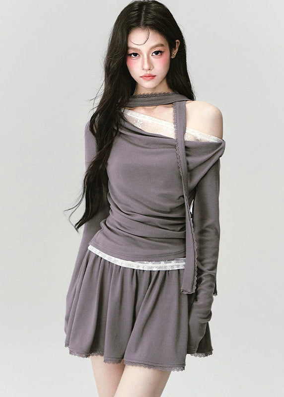 The Migratory Lace Sonata Set drapes the body in Fragileheart’s signature melancholy elegance. A soft ashen knit wraps asymmetrically over lace, revealing just enough fragility beneath structure. Paired with a flowing skirt trimmed in translucent lace, it moves like twilight — graceful, introspective, and quietly magnetic.