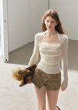 Women's white ruched neckline top with delicate lace trim