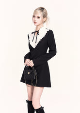 A refined Korean-style holiday dress set featuring a lace-trimmed bow collar mini dress paired with a luxurious woolen cape. The silhouette is soft yet slimming, blending sweet elegance with VOCK’s signature modern edge. Perfect for winter dates, parties, and seasonal photos.